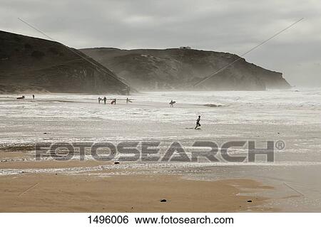 View of people on a beach and cliffs, Praia da Arrifana, Portugal beach View Large Photo Image Stock Photograph - View of people on a beach and cliffs, Praia da Arrifana, Portugal beach. Fotosearch