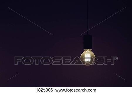 Vintage electric light bulb illuminated against black background View Large Photo Image Stock Photograph - Vintage electric light bulb illuminated against black background. Fotosearch