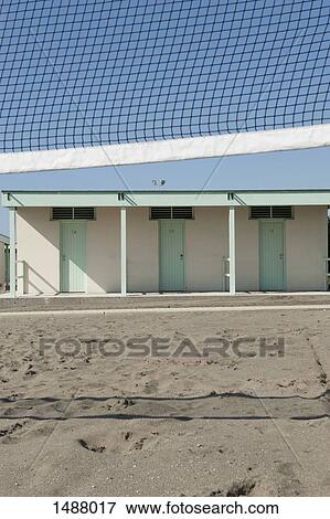 Volleyball net and huts at beach on sunny day View Large Photo Image Stock Photo - Volleyball net and huts at beach on sunny day. Fotosearch