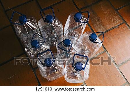 Water bottles with handles ready for recycling View Large Photo Image Stock Image - Water bottles with handles ready for recycling. Fotosearch
