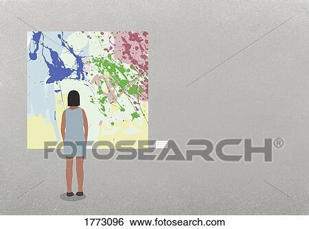 Stock Photograph - Woman looking at abstract painting in museum. Fotosearch