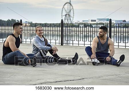 Young athletes resting on promenade, Blagoveshchensk, Amur, Russia View Large Photo Image Stock Image - Young athletes resting on promenade, Blagoveshchensk, Amur, Russia. Fotosearch