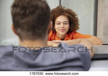 Young couple talking over car View Large Photo Image Stock Photography - Young couple talking over car. Fotosearch