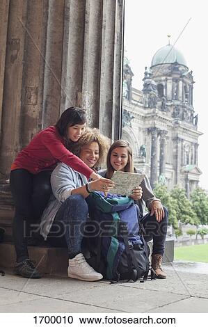 Young female tourists reading map at Altes Museum against Berlin Cathedral, Germany View Large Photo Image Stock Image - Young female tourists reading map at Altes Museum against Berlin Cathedral, Germany. Fotosearch