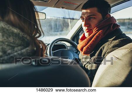Young woman staring at woman in car View Large Photo Image Stock Photo - Young woman staring at woman in car. Fotosearch