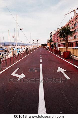 directional arrows on a street in a town along the coast View Large Photo Image Stock Image - directional arrows on a street in a town along the coast. Fotosearch