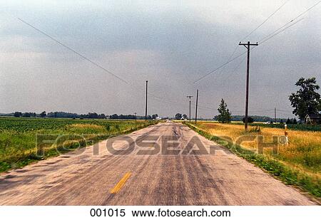 rural road surrounded by countryside View Large Photo Image Stock Photography - rural road surrounded by countryside. Fotosearch