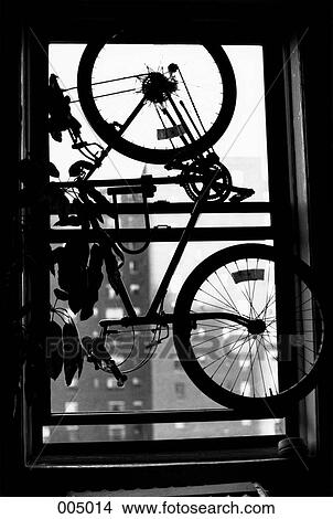A bicycle hanging in a window View Large Photo Image Picture - A bicycle hanging in a window. Fotosearch