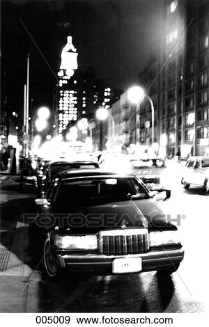 A limousine on a New York city street at night View Large Photo Image Stock Photo - A limousine on a New York city street at night. Fotosearch