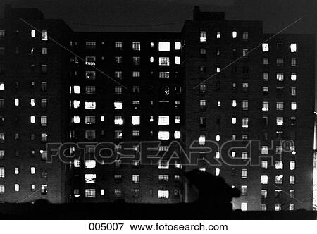 Stock Photo - A New York city apartment building at night. Fotosearch