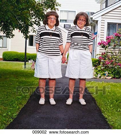elderly female twins holding hands View Large Photo Image Stock Image - elderly female twins holding hands. Fotosearch
