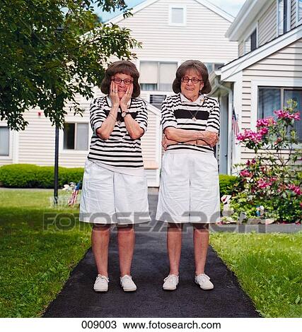 Stock Image - elderly twins laughing. Fotosearch