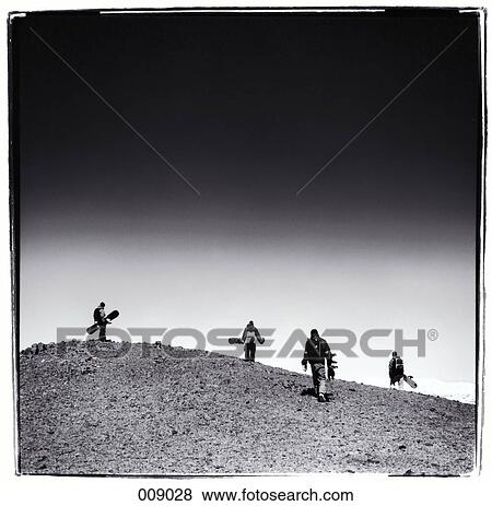 group of snowboarders climbing a hill View Large Photo Image Stock Photo - group of snowboarders climbing a hill. Fotosearch