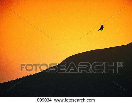 snowboarder jumping in sihlouette View Large Photo Image Picture - snowboarder jumping in sihlouette. Fotosearch
