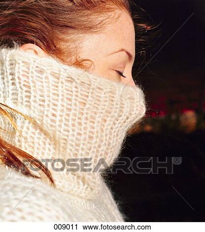 woman hiding face behind sweater, side-view View Large Photo Image Stock Image - woman hiding face behind sweater, side-view. Fotosearch