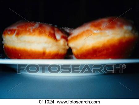 Picture - two doughnuts on a plate. Fotosearch