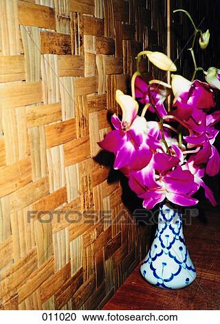 vase of pink flowers next to a wooden wall View Large Photo Image Stock Image - vase of pink flowers next to a wooden wall. Fotosearch