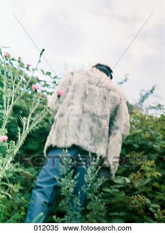 man peering into field View Large Photo Image Stock Photography - man peering into field. Fotosearch