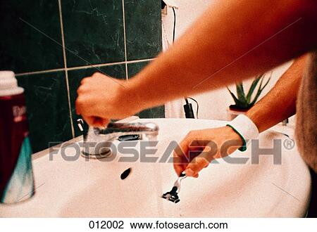 Stock Image - man preparing to shave. Fotosearch