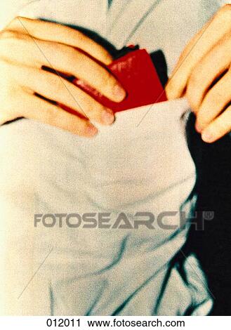 man putting wallet into pocket View Large Photo Image Stock Image - man putting wallet into pocket. Fotosearch
