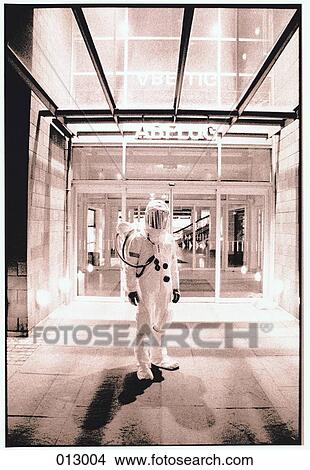 person in an astronaut suit standing before an entrance View Large Photo Image Picture - person in an astronaut suit standing before an entrance. Fotosearch