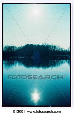 sun reflect off of a lake View Large Photo Image Stock Image - sun reflect off of a lake. Fotosearch