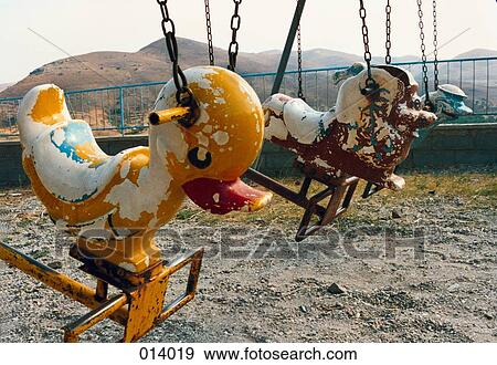 old swings on a playground View Large Photo Image Stock Photo - old swings on a playground. Fotosearch