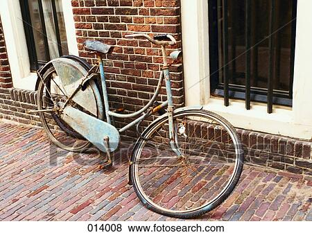 rusted bicycle with broken wheel leaning against a building View Large Photo Image Stock Photo - rusted bicycle with broken wheel leaning against a building. Fotosearch