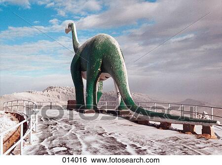 snow-covered dinosaur sculpture View Large Photo Image Stock Photograph - snow-covered dinosaur sculpture. Fotosearch