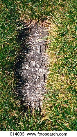 stone in the grass with writing on it View Large Photo Image Stock Image - stone in the grass with writing on it. Fotosearch