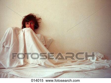 woman covered in sheets, leaning against the wall View Large Photo Image Stock Photography - woman covered in sheets, leaning against the wall. Fotosearch