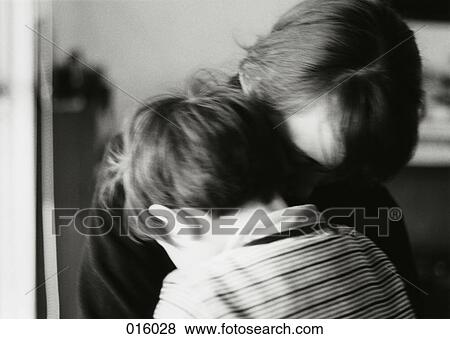a parent and child holding each other View Large Photo Image Stock Photo - a parent and child holding each other. Fotosearch