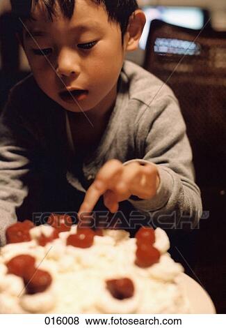 child touching cherries on top of a cake View Large Photo Image Stock Photo - child touching cherries on top of a cake. Fotosearch