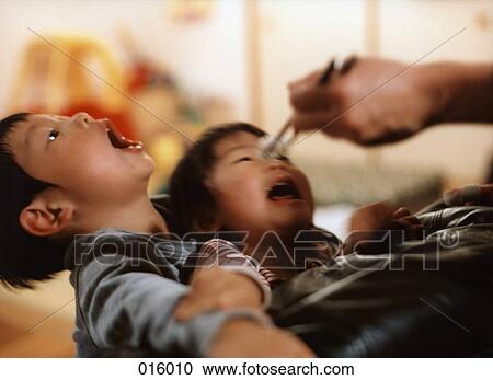 children with mouths open waiting for food from chopsticks View Large Photo Image Stock Image - children with mouths open waiting for food from chopsticks. Fotosearch