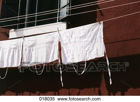 Stock Photography - aprons hanging on a clothes line. Fotosearch