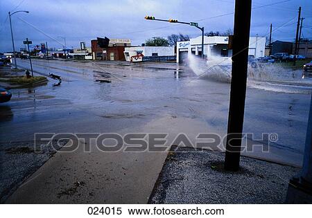 Flooded intersection in a deserted town View Large Photo Image Stock Photography - Flooded intersection in a deserted town. Fotosearch