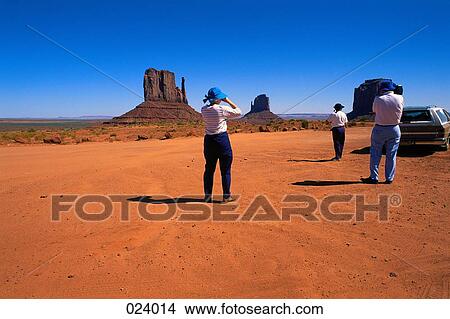 Group of people standing in the desert View Large Photo Image Picture - Group of people standing in the desert. Fotosearch