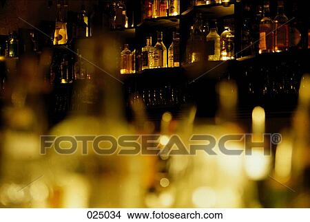 barglasses and bottles at night View Large Photo Image Picture - barglasses and bottles at night. Fotosearch