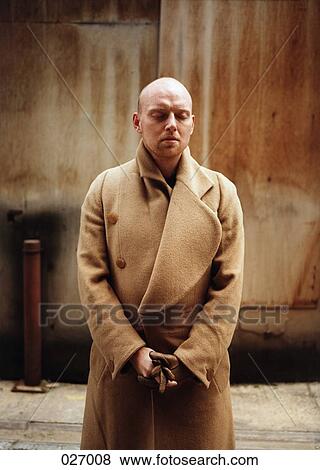 A bald man in a winter jacket, looking down View Large Photo Image Stock Photo - A bald man in a winter jacket, looking down. Fotosearch