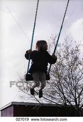 A child swinging View Large Photo Image Stock Photo - A child swinging. Fotosearch