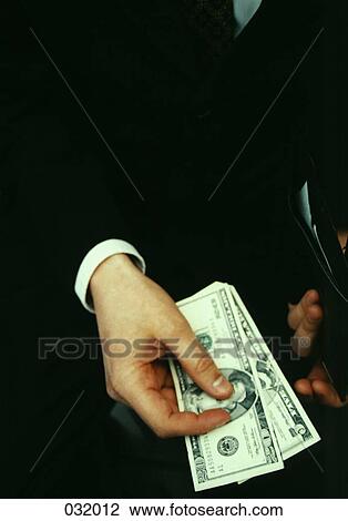 A businessman paying cash View Large Photo Image Stock Image - A businessman paying cash. Fotosearch