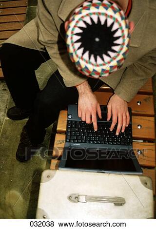 A man typing on a laptop from above View Large Photo Image Stock Photo - A man typing on a laptop from above. Fotosearch
