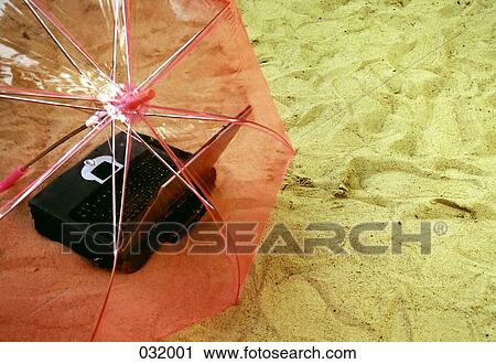 An umbrella over a laptop View Large Photo Image Stock Image - An umbrella over a laptop. Fotosearch