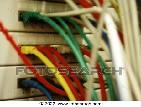 Multicolored cable protruding from a network box View Large Photo Image Stock Photo - Multicolored cable protruding from a network box. Fotosearch