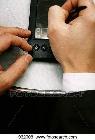 Writing on a PDA View Large Photo Image Stock Photo - Writing on a PDA. Fotosearch