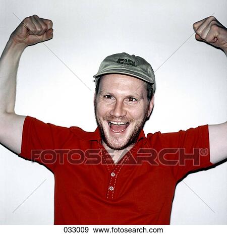 A happy man with his arms victoriously raised View Large Photo Image Stock Photo - A happy man with his arms victoriously raised. Fotosearch