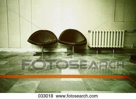 Two black chairs in a waiting lounge View Large Photo Image Stock Photo - Two black chairs in a waiting lounge. Fotosearch