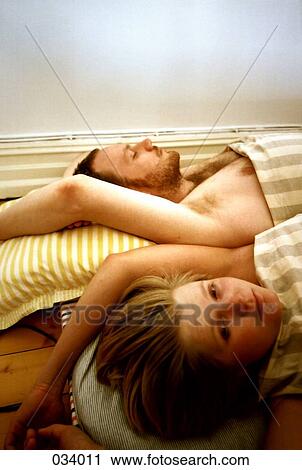 A man and woman waking up View Large Photo Image Stock Image - A man and woman waking up. Fotosearch