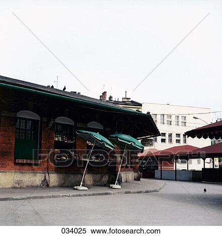 Leaning umbrellas outside a restaurant View Large Photo Image Stock Photography - Leaning umbrellas outside a restaurant. Fotosearch