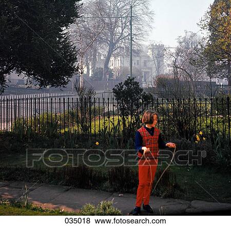 A young girl with a jump rope on the sidewalk View Large Photo Image Stock Photo - A young girl with a jump rope on the sidewalk. Fotosearch